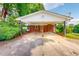 Charming brick home with a convenient carport and lush landscaping at 9455 Boston Rd, Roxboro, NC 27574