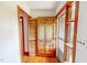 Inviting entryway featuring a wooden door, natural light, and unique architectural details at 9455 Boston Rd, Roxboro, NC 27574