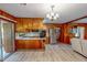 Functional kitchen features updated appliances, wood cabinets, and sliding door to the outside at 9455 Boston Rd, Roxboro, NC 27574