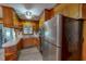 Kitchen featuring stainless steel refrigerator, ample cabinet and a view to the outside at 9455 Boston Rd, Roxboro, NC 27574