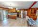 Eat-in kitchen with stainless steel appliances, wood cabinetry and a view to the living room at 9455 Boston Rd, Roxboro, NC 27574