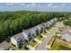 An aerial view of a suburban neighborhood, highlighting a variety of home styles and lush landscaping at 958 Bay Bouquet Ln, Apex, NC 27523