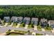 An aerial view of a residential neighborhood showcasing well-maintained homes and green spaces at 958 Bay Bouquet Ln, Apex, NC 27523