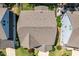 Birds-eye view of backyard landscaping and house roofs in a well-kept neighborhood at 958 Bay Bouquet Ln, Apex, NC 27523