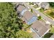 Aerial view of backyards with green space and mature trees at 958 Bay Bouquet Ln, Apex, NC 27523