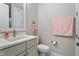 Elegant half bathroom features modern fixtures, marble vanity, and a clean, neutral color palette at 958 Bay Bouquet Ln, Apex, NC 27523