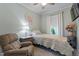 Cozy bedroom features bright walls, a comfortable single bed, and a large window for natural light at 958 Bay Bouquet Ln, Apex, NC 27523