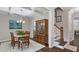 Elegant dining room featuring a stylish chandelier, coffered ceiling, and hardwood floors at 958 Bay Bouquet Ln, Apex, NC 27523