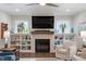 Close up of the fireplace, adorned with shelves and décor at 958 Bay Bouquet Ln, Apex, NC 27523