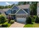 Beautiful two-story home with manicured lawn, stone accents, and an attached two-car garage at 958 Bay Bouquet Ln, Apex, NC 27523