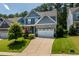Well-maintained home with a manicured lawn and inviting curb appeal at 958 Bay Bouquet Ln, Apex, NC 27523