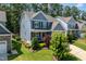 Beautifully landscaped yard and a charming two-story home with a welcoming front porch at 958 Bay Bouquet Ln, Apex, NC 27523