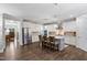 Full kitchen view features an island with seating, stainless appliances and views of the entryway and kitchen nook at 958 Bay Bouquet Ln, Apex, NC 27523