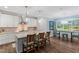 Modern kitchen featuring granite countertops, stainless steel appliances, and a breakfast bar at 958 Bay Bouquet Ln, Apex, NC 27523