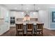 Bright kitchen with a large island, granite countertops, and stainless steel appliances at 958 Bay Bouquet Ln, Apex, NC 27523