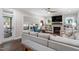Cozy living room featuring a fireplace, built-in bookshelves, and a comfortable seating area at 958 Bay Bouquet Ln, Apex, NC 27523