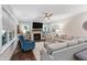 Bright living room with a fireplace, built-in shelving, and comfortable seating at 958 Bay Bouquet Ln, Apex, NC 27523