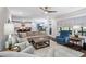 Open-concept living area with hardwood floors, comfortable seating, and access to the kitchen at 958 Bay Bouquet Ln, Apex, NC 27523