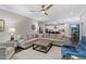 Spacious living area with hardwood floors, a comfortable sectional, and access to the kitchen at 958 Bay Bouquet Ln, Apex, NC 27523