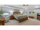 Bright main bedroom features a ceiling fan, sitting area, and neutral color palette at 958 Bay Bouquet Ln, Apex, NC 27523