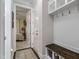 Functional mudroom includes built-in storage, bench, and convenient access to the bedroom at 958 Bay Bouquet Ln, Apex, NC 27523