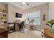 Cozy office space with natural light, ceiling fan, and built-in shelving at 958 Bay Bouquet Ln, Apex, NC 27523