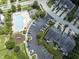 A bird's eye view shows a swimming pool, clubhouse, and playground for the community at 100 Beaconwood Ln, Holly Springs, NC 27540