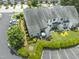 Aerial view of the home featuring a landscaped yard, patio, and parking at 100 Beaconwood Ln, Holly Springs, NC 27540