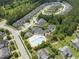 Community aerial view featuring the pool, playground, parking and surrounding homes at 100 Beaconwood Ln, Holly Springs, NC 27540