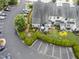 This aerial image showcases a private patio with seating and a well-manicured lawn at 100 Beaconwood Ln, Holly Springs, NC 27540
