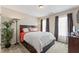 Comfortable bedroom featuring a wooden bed frame, soft lighting, and decorative accents at 100 Beaconwood Ln, Holly Springs, NC 27540