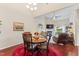 Cozy dining room with a round table, seating for four, and views of the living area at 100 Beaconwood Ln, Holly Springs, NC 27540