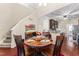 Dining room featuring a round table and chairs, open to the kitchen area at 100 Beaconwood Ln, Holly Springs, NC 27540