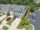 Charming home with a two-car garage, manicured lawn, and ample parking at 100 Beaconwood Ln, Holly Springs, NC 27540