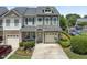 Charming home with front porch, manicured lawn, a one car garage, and landscaping at 100 Beaconwood Ln, Holly Springs, NC 27540