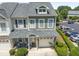 Charming home with front porch, manicured lawn, and a one car garage at 100 Beaconwood Ln, Holly Springs, NC 27540