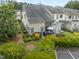 Aerial view of backyard with seating and well-maintained landscaping for relaxing at 100 Beaconwood Ln, Holly Springs, NC 27540