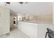 Bright hallway with neutral carpet, white walls, and access to multiple rooms at 100 Beaconwood Ln, Holly Springs, NC 27540