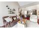 Inviting living room showcasing a vaulted ceiling and seamless access to the dining area and the upper level staircase at 100 Beaconwood Ln, Holly Springs, NC 27540