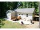 Aerial view of backyard featuring lawn, patio, deck and trees at 1006 Oxford Ridge Rd, Wake Forest, NC 27587