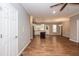 Open-concept living room and kitchen featuring hardwood floors and natural light at 1006 Oxford Ridge Rd, Wake Forest, NC 27587