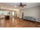 Spacious living room and kitchen with hardwood floors and modern lighting at 1006 Oxford Ridge Rd, Wake Forest, NC 27587
