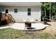 Backyard patio with fire pit, grill, and seating area at 1006 Oxford Ridge Rd, Wake Forest, NC 27587