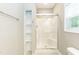 Bathroom featuring a shower with a sliding glass door and shelving at 1006 Oxford Ridge Rd, Wake Forest, NC 27587