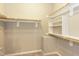 Empty walk-in closet with shelving and hanging racks for storage at 1006 Oxford Ridge Rd, Wake Forest, NC 27587
