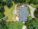 Gorgeous outdoor living space complete with firepit and patio seating, surrounded by lush greenery at 1009 Bentham Dr, Raleigh, NC 27614