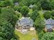 Beautiful home featuring a deck, patio, fire pit, and meticulously landscaped backyard, perfect for outdoor enjoyment at 1009 Bentham Dr, Raleigh, NC 27614