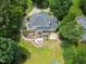 Backyard oasis featuring a firepit, deck and patio seating, perfect for entertaining guests and enjoying nature at 1009 Bentham Dr, Raleigh, NC 27614