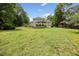 Expansive backyard featuring a well-maintained lawn and multi-level deck at 1009 Bentham Dr, Raleigh, NC 27614