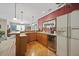 Inviting bar area with wooden cabinets, wine cooler, and plenty of counter space at 1009 Bentham Dr, Raleigh, NC 27614